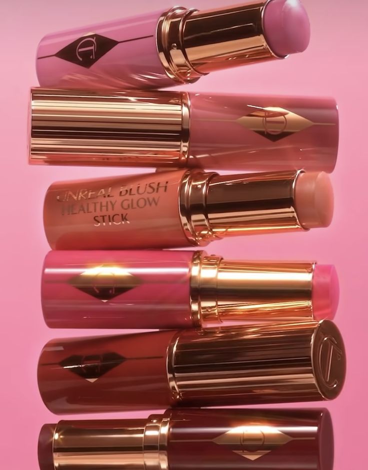 Charlotte Tilbury Pillow Talk lipstick stack, rose gold cases on pink