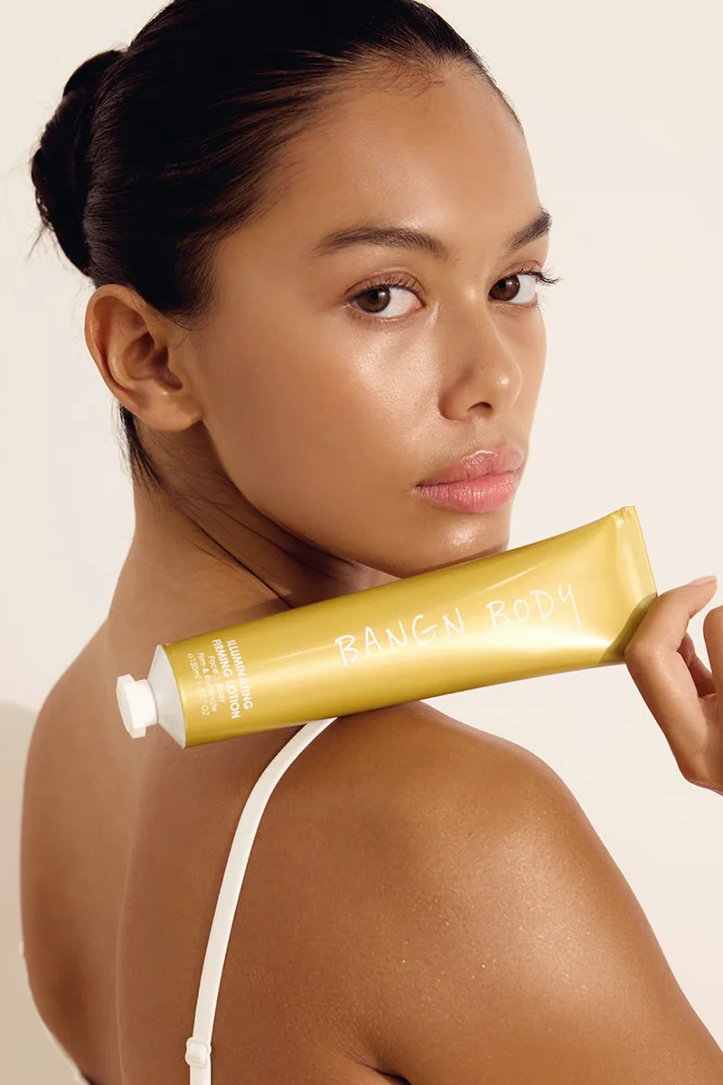 Model wearing Bangn Body Firming Lotion, pretty, but a moisturiser